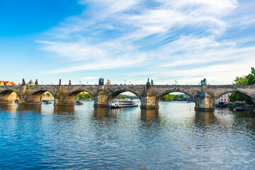Fototapeta premium Summer landscape of Prague view of the Ltava river and the famous Charles bridge