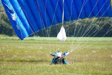 Tandem skydiving landing colourful photography.