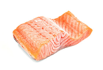 Piece of frozen salmon fillet sliced isolated on white background