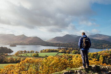 Male walker admiring taking in the view over Derwent Water, Cumb