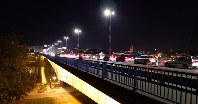 Night Timelapse, made with Long Exposure Pictures, of Cars and Vehicles with Light Trails over the Branko's Bridge (Brankov most) in Belgrade Serbia over the Sava River Water