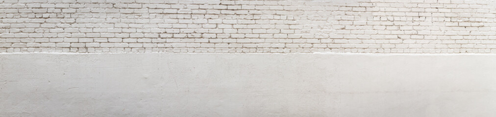 Long panorama of white brick split with white stucco, creative dual copy space, horizontal aspect