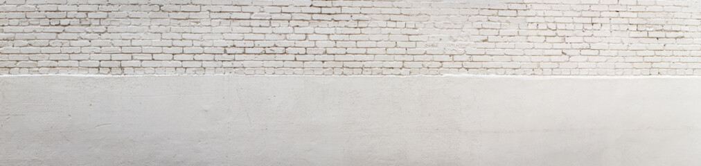 Long panorama of white brick split with white stucco, creative dual copy space, horizontal aspect