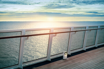 Cruise ship railing at sunset.