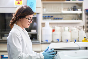 Science student working with lab centrifuge machine