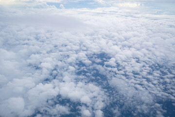 Obraz na płótnie Canvas Beautiful view of blue sky over the clouds, view from airplane window