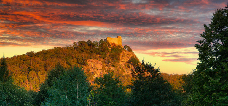 Ruins of Chojnik Castle in Karkonosze mountains at sunset. Poland