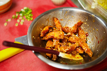 Fried chicken strips in fast food restaurant.Delicious poultry meat stripes cooked in deep fryer