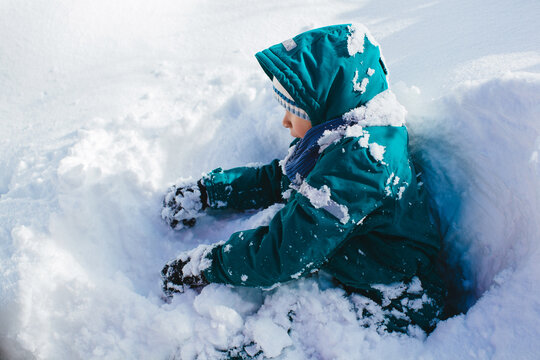 Boy playing at snow