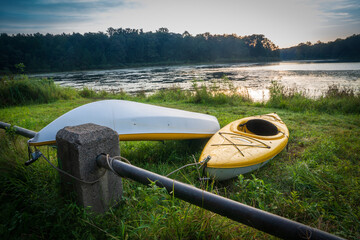 Kayaks on the shore in the morning with cables for security