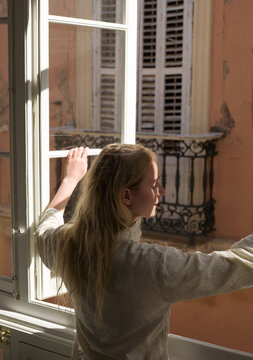 Woman opening window