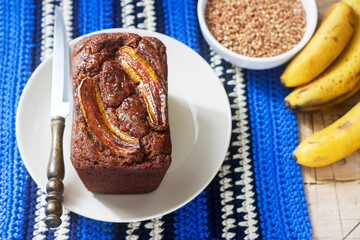 Homemade buckwheat banana cake with honey glaze. Gluten free baking.