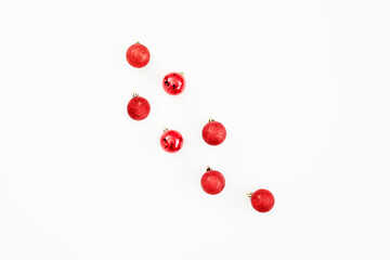 Christmas concept with red balls decoration on white background. Flat lay