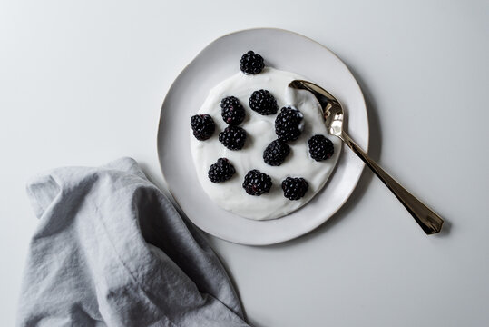 Healthy and simple greek yogurt and blackberry snack for breakfast