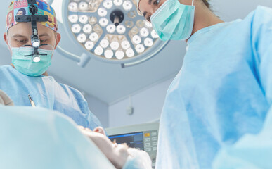 Man surgeon at work in operating room