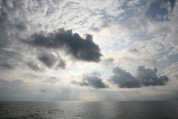 Black clouds coming down at sea - 379959998
