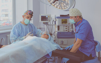 Man surgeon at work in operating room