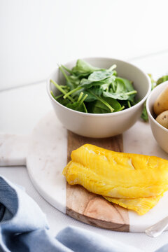 Ingredients for making a healthy smoked haddock dish.
