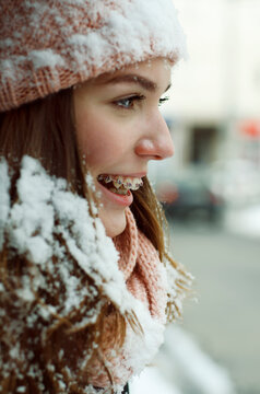 Portrait of teenage girl cover with snow with denture