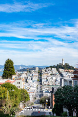 Fototapeta na wymiar San Francisco, USA, March 30, 2020: Lombard Street, east west street in San Francisco, California famous for a steep, one block section with eight hairpin turns.