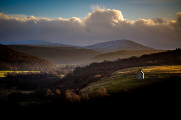 Landscape in winter in the Cairngorms National Park in Scotland at Sunset