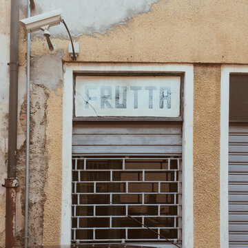Old store sign saying Fruit in italian town
