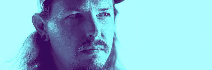 Thoughtful. Close up portrait of caucasian man isolated on studio background. Modern and trendy...