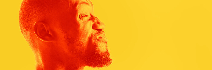 Happy. Close up portrait of african man isolated on studio background. Modern and trendy duotone...