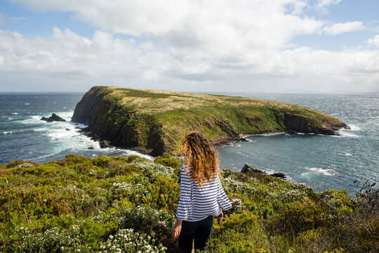 Woman walking down a bush path
