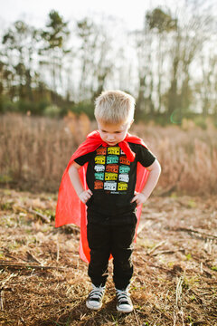 Little boy in imaginary cape