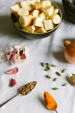 Coriander seeds, turmeric and other spices and vegetables.
