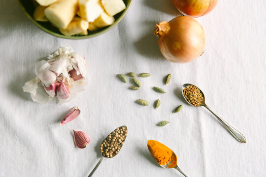 Coriander seeds, turmeric and other spices and vegetables.