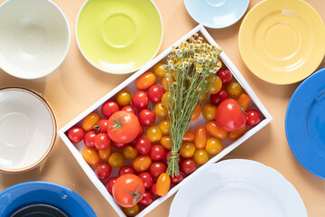 Ripe cherry tomatoes in a wooden box.