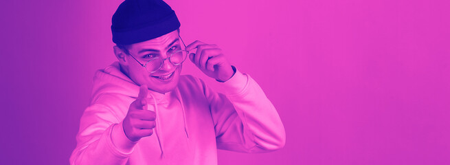 Choosing you. Close up portrait of caucasian man isolated on studio background. Modern and trendy...