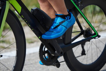 Naklejka premium closeup of triathlon athlete riding bike