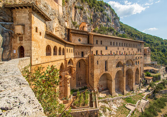 
Subiaco, Italy - main sight of Subiaco and one of the most beautiful Benedictine monasteries in the World, the Sacro Speco Monastery displays amazing frescoes. Here in particular its exteriors - obrazy, fototapety, plakaty