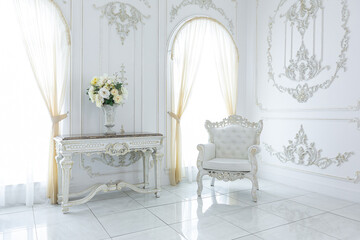 luxury royal posh interior in baroque style. very bright, light and white hall with expensive...