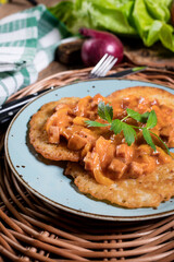 Homemade potato pancakes with goulash.