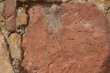 Hintergrund Steinmauer Natursteinmauer aus roten Steinen