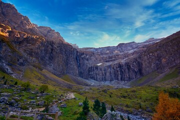 Cirque de Gavarnie in France with some pine trees in the front