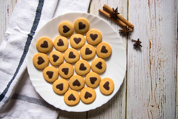 Top view of a plate of freshly baked cookies on a background with use of selective focus.