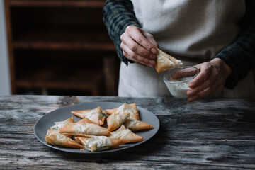 Person with plate filled with spanakopita