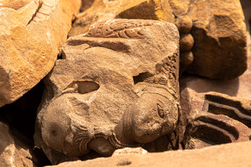 ancient destroyed ruined  statue of indian god at harsh mountain sikar,rajasthan