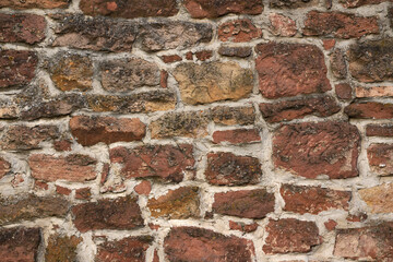 Hintergrund Steinmauer Natursteinmauer aus roten Steinen