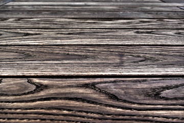 Fototapeta premium Natural wood structure of thermo ash, several boards arranged horizontally, Texture Background Wallpaper 