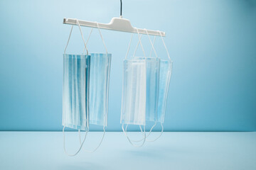 Surgical protective face mask on blue background