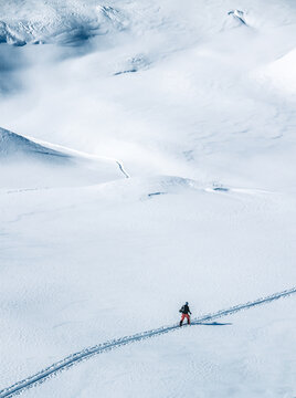 ski tourer on big mountains in a winterlandscape