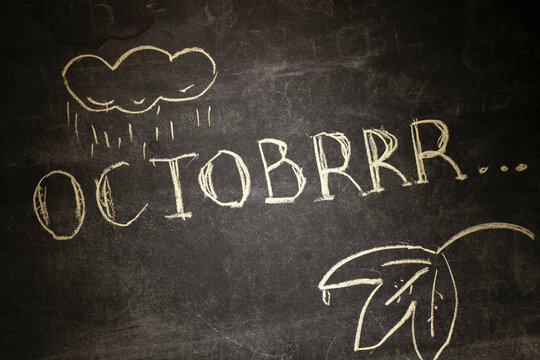 the chalk inscription OCTOBRRR, intentionally misspelling the word October, symbolizes the onset of cold weather in autumn, the arrival of rain and cloudy weather. brrrr...