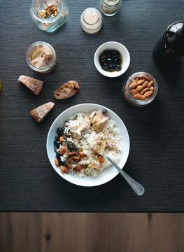 Healthy rice with tuna, almonds and black olives