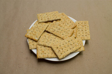 Crispy crackers in a plate white.